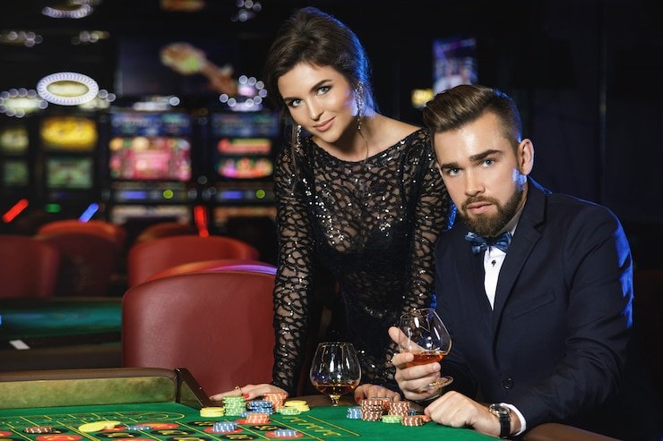 Baccarat table with player, banker, and tie bet zones